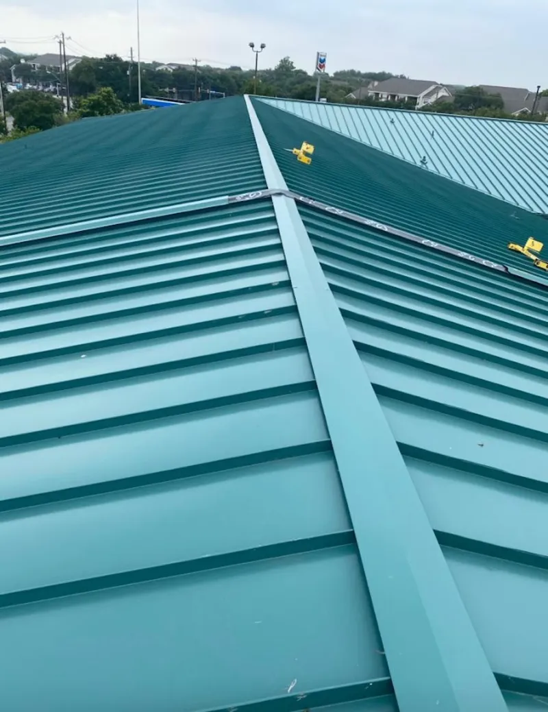 Green commercial metal roof ridge and valley for Metal Roof Repair in Louisville